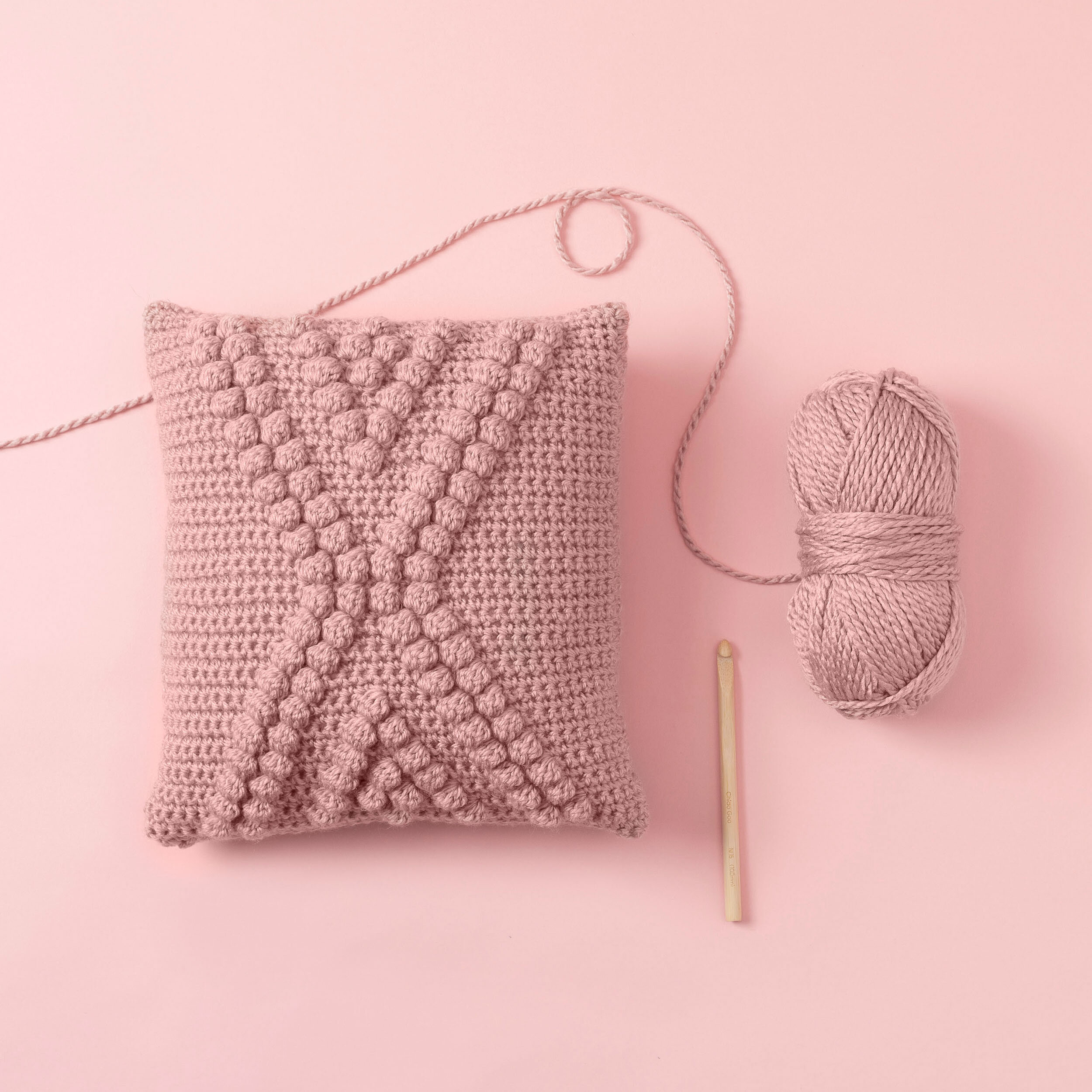 pink yarn and pillow